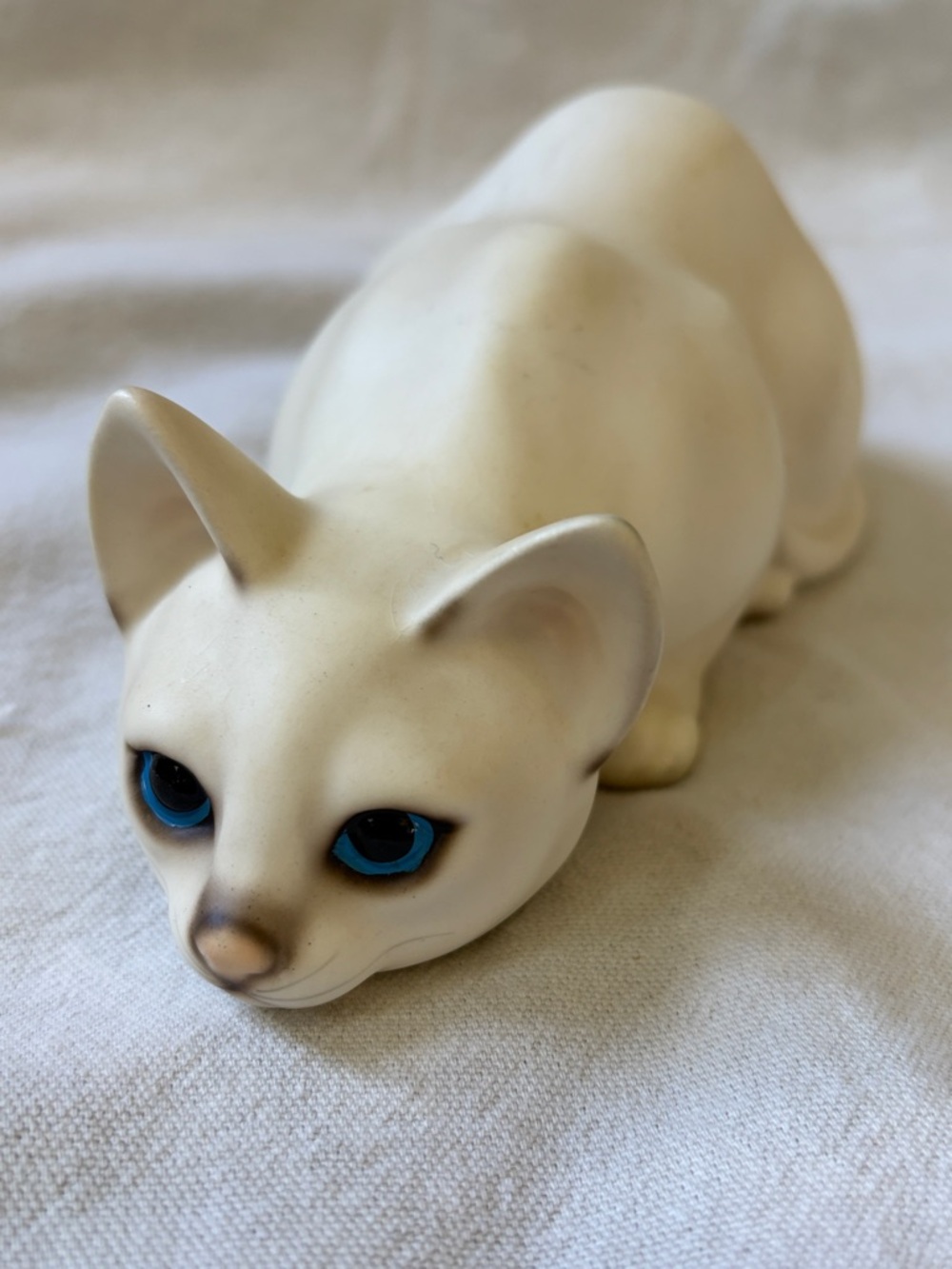 White Ceramic Cat Figurine with Blue Eyes